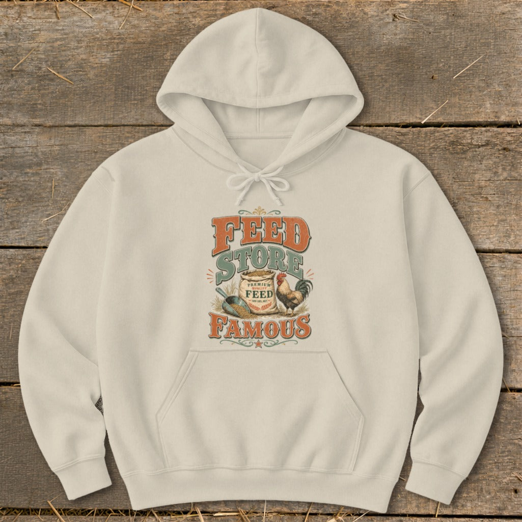 Cream hoodie with "Feed Store Famous" text and graphic of chicken and feed bag.