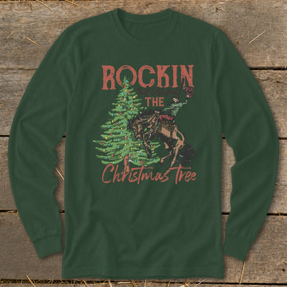Green long-sleeve shirt with graphic of bronco rider and Christmas tree.