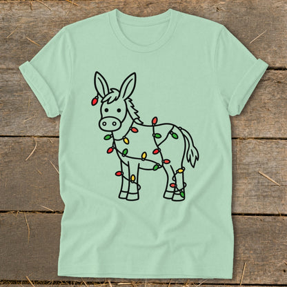 Light green t-shirt with a cartoon donkey wrapped in colorful Christmas lights.