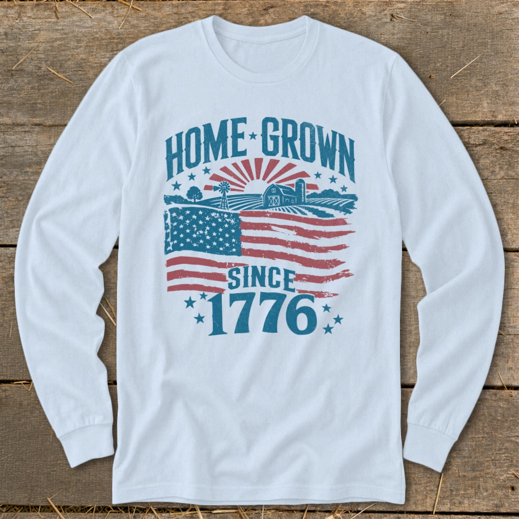 White long sleeve shirt with "HOME GROWN SINCE 1776" graphic and American flag elements.
