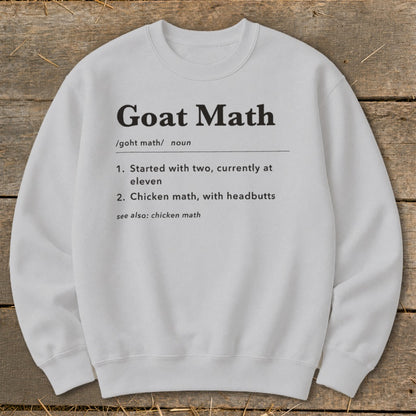 White sweatshirt with "Goat Math" definition and numbered list.