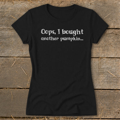 Black t-shirt with white text "Oops, I bought another pumpkin..."