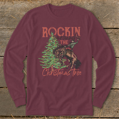 Maroon long sleeve shirt with "Rockin Around The Christmas Tree" and bucking bronco graphic.