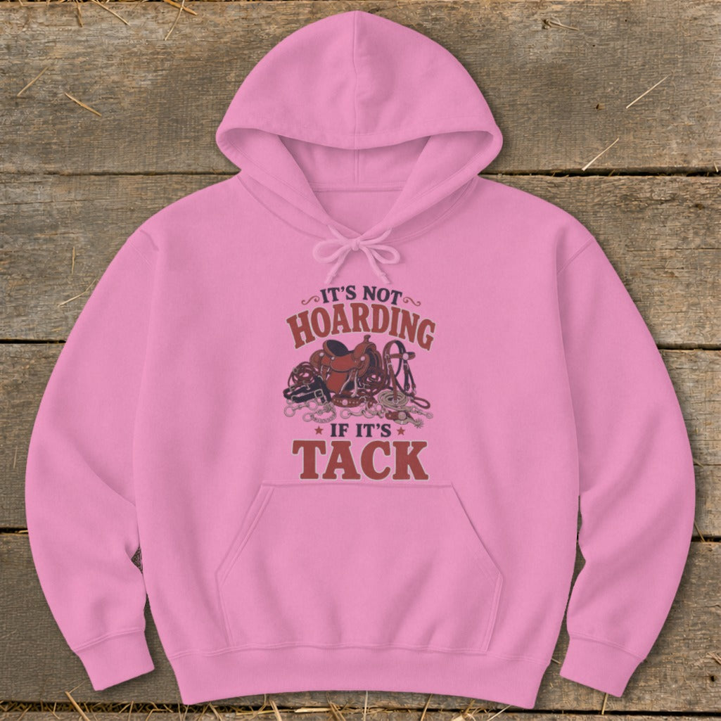 Pink hoodie with text "It's not hoarding if it's tack" and horse tack graphic.