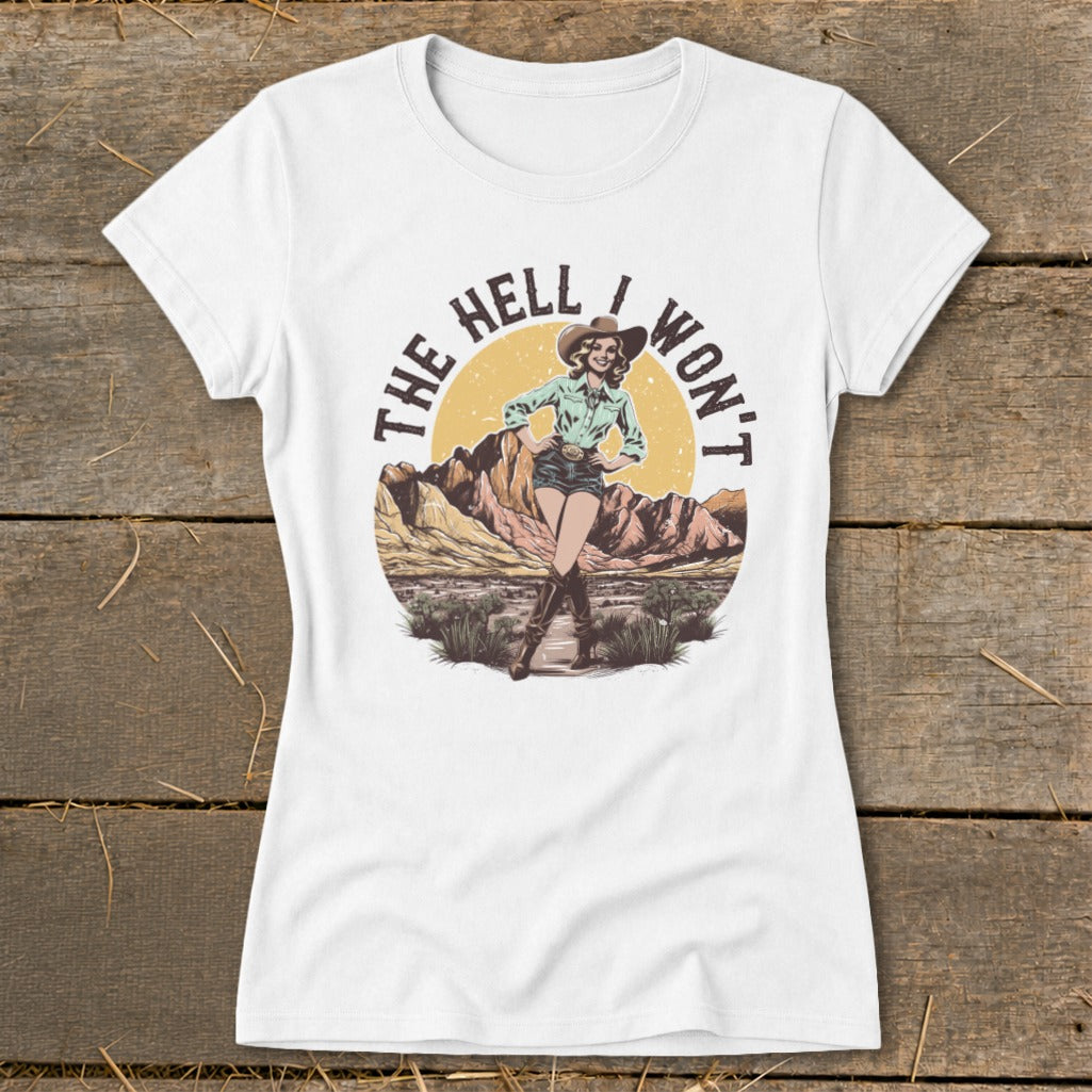 White t-shirt with graphic of woman in cowboy hat and desert scene, text "THE HELL I WON'T".