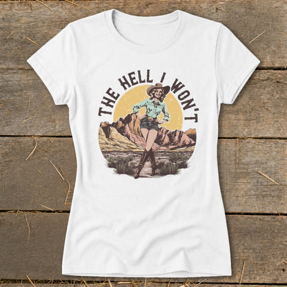 White t-shirt with graphic of woman in cowboy hat and desert scene, text "THE HELL I WON'T".