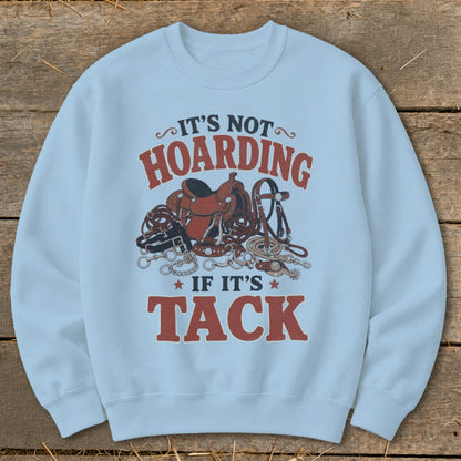 Light blue sweatshirt with "It's not hoarding if it's tack" text and horse tack graphic.
