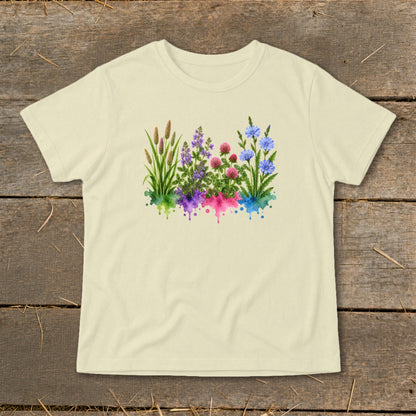 Cream-colored short-sleeve t-shirt with a central watercolor graphic of wildflowers and dripping colorful paint.