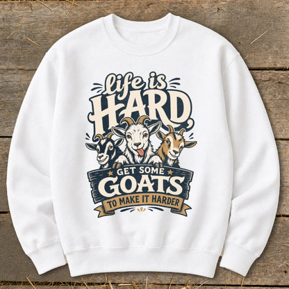 White sweatshirt with cartoon goats and text "life is HARD GET SOME GOATS TO MAKE IT HARDER".