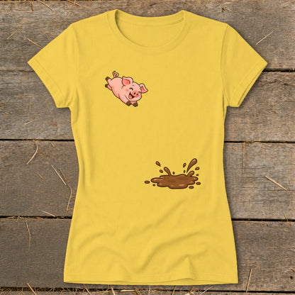Yellow t-shirt with a cartoon pig jumping above a mud splash graphic.