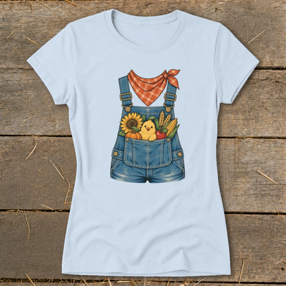 Light blue t-shirt with denim overalls graphic featuring a chick, sunflower, pumpkin, corn, and apple.