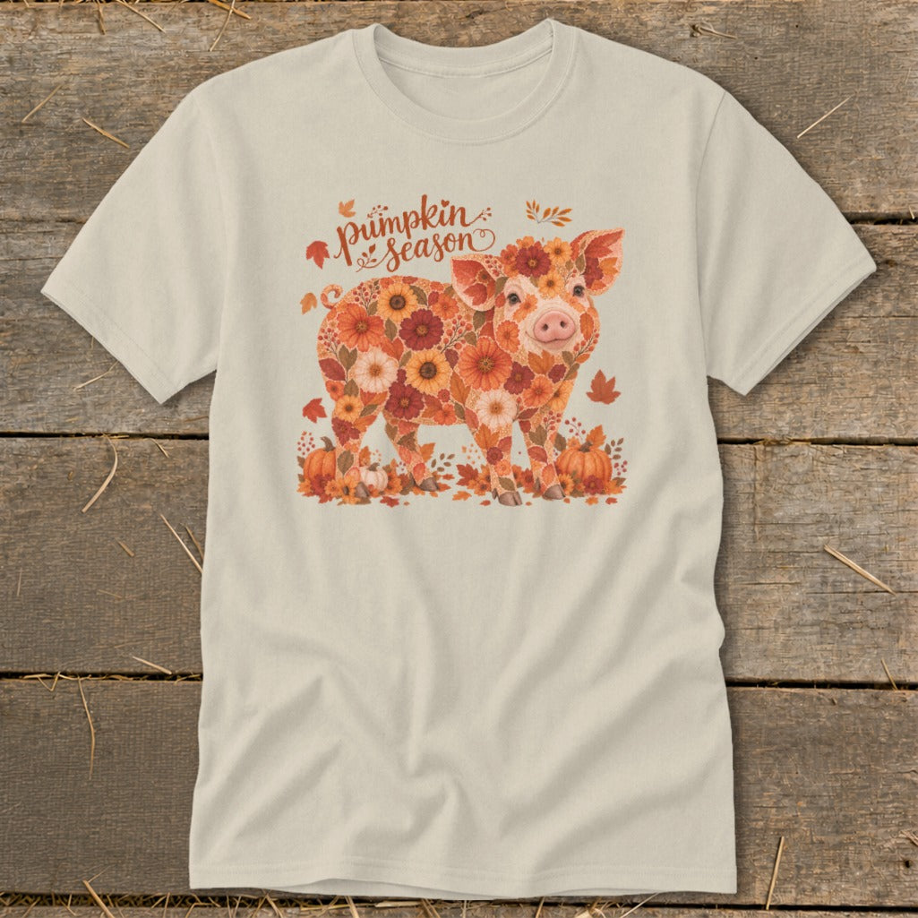 Pig made of flowers with "pumpkin season" text and fall leaves.