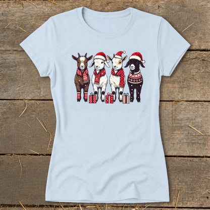 Four cartoon goats wearing Santa hats and scarves stand in front of gift boxes.