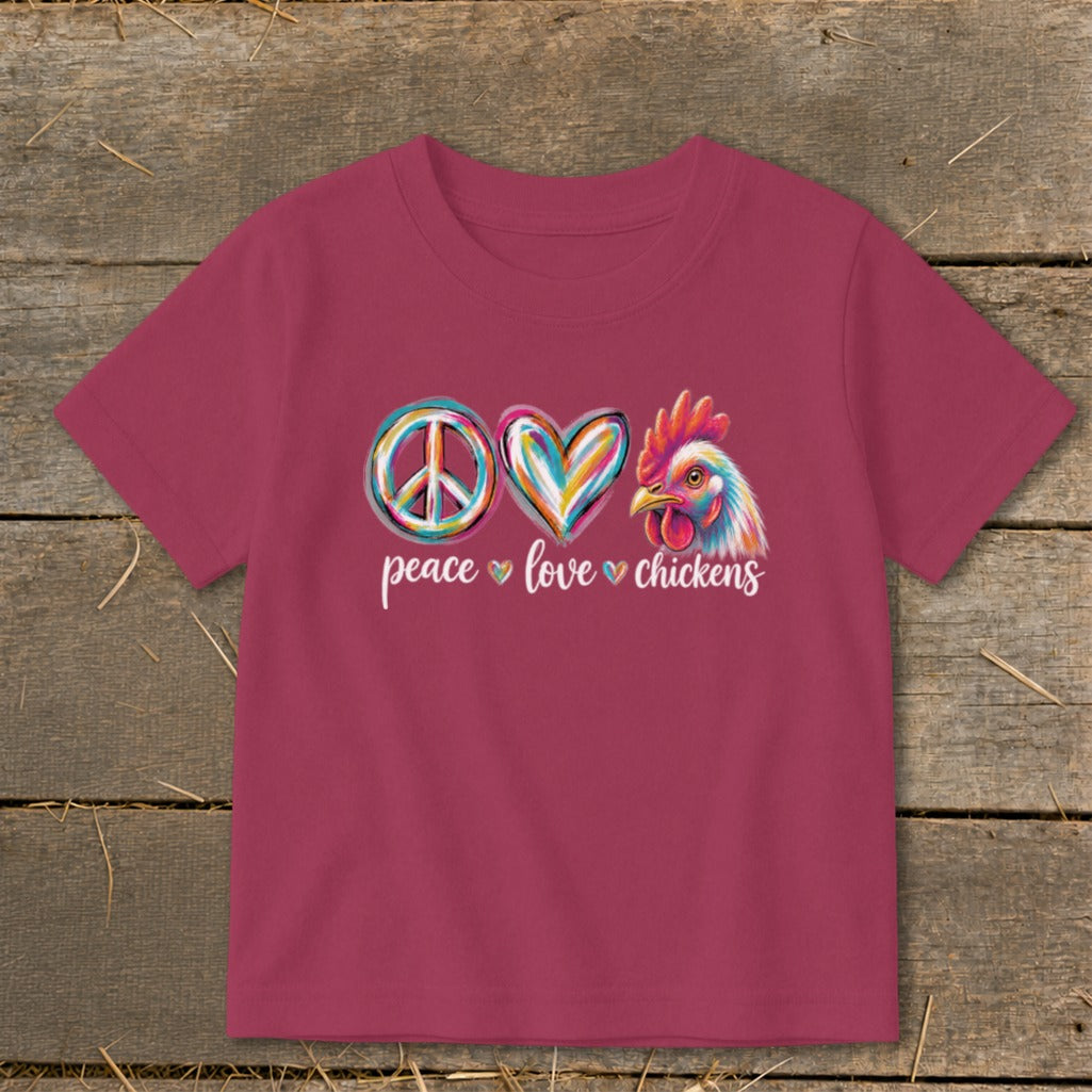 Pink t-shirt with "Peace Love Chickens" graphic and colorful chicken.