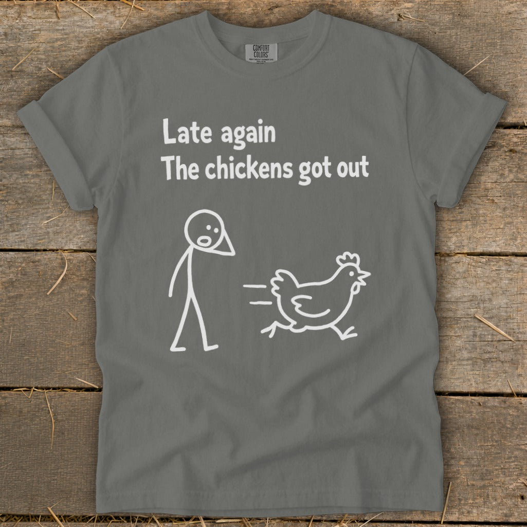T-shirt with text "Late again the chickens got out" and stick figures.