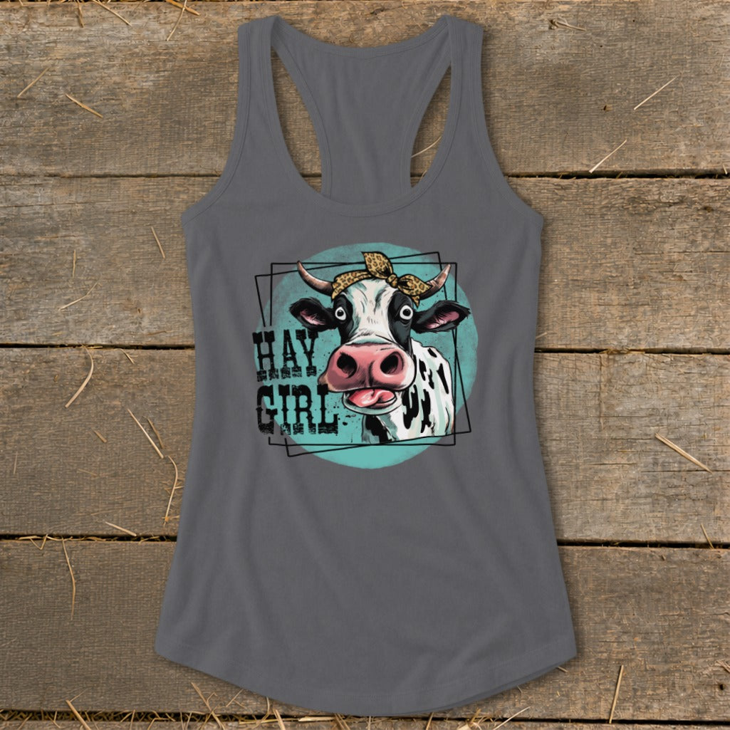 Cow with bandana and "Hay Girl" text on a grey tank top.
