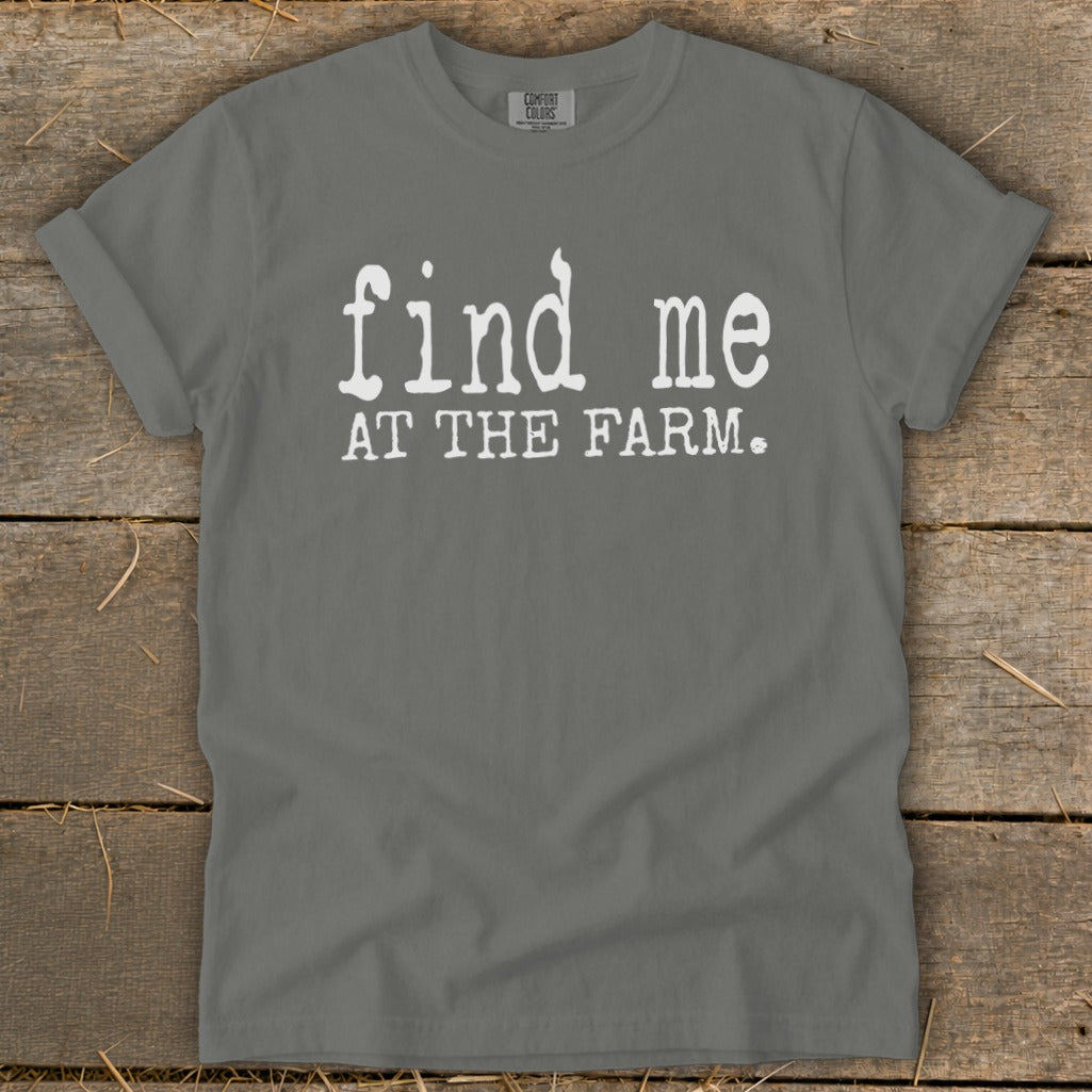 Grey t-shirt with white text that reads "find me AT THE FARM."