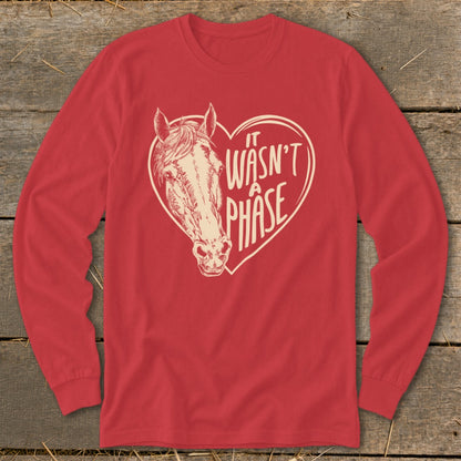 Red long sleeve shirt with a horse head inside a heart that reads "It Wasn't a Phase."