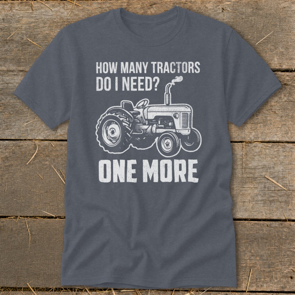 Gray t-shirt with white text "HOW MANY TRACTORS DO I NEED? ONE MORE" and tractor graphic.