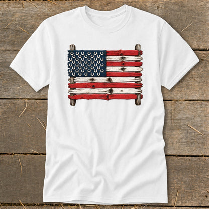 White t-shirt displaying a graphic of the American flag made of painted wooden planks with horseshoe stars.