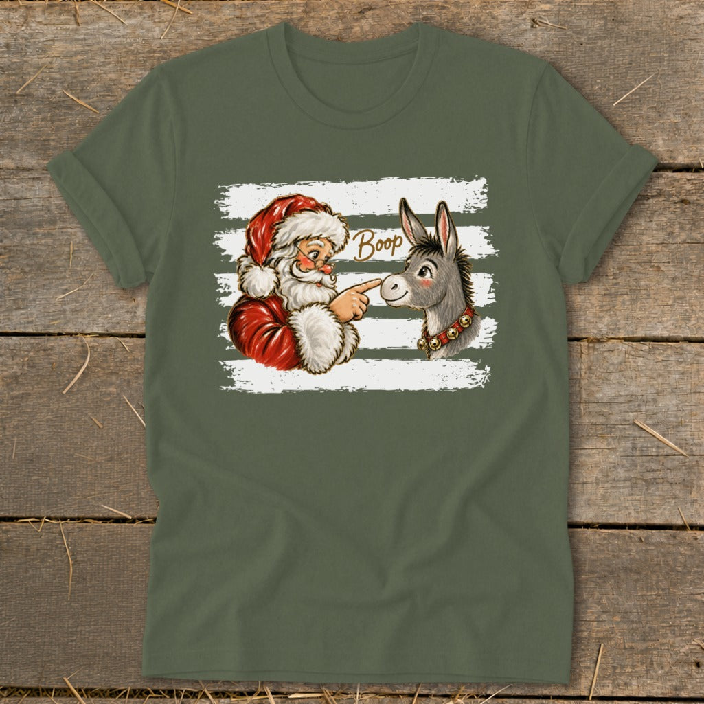 Santa booping a donkey with the word "Boop" on a green t-shirt.