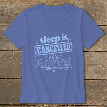 Blue v-neck t-shirt with "sleep is CANCELLED it's FAIR WEEK" graphic.