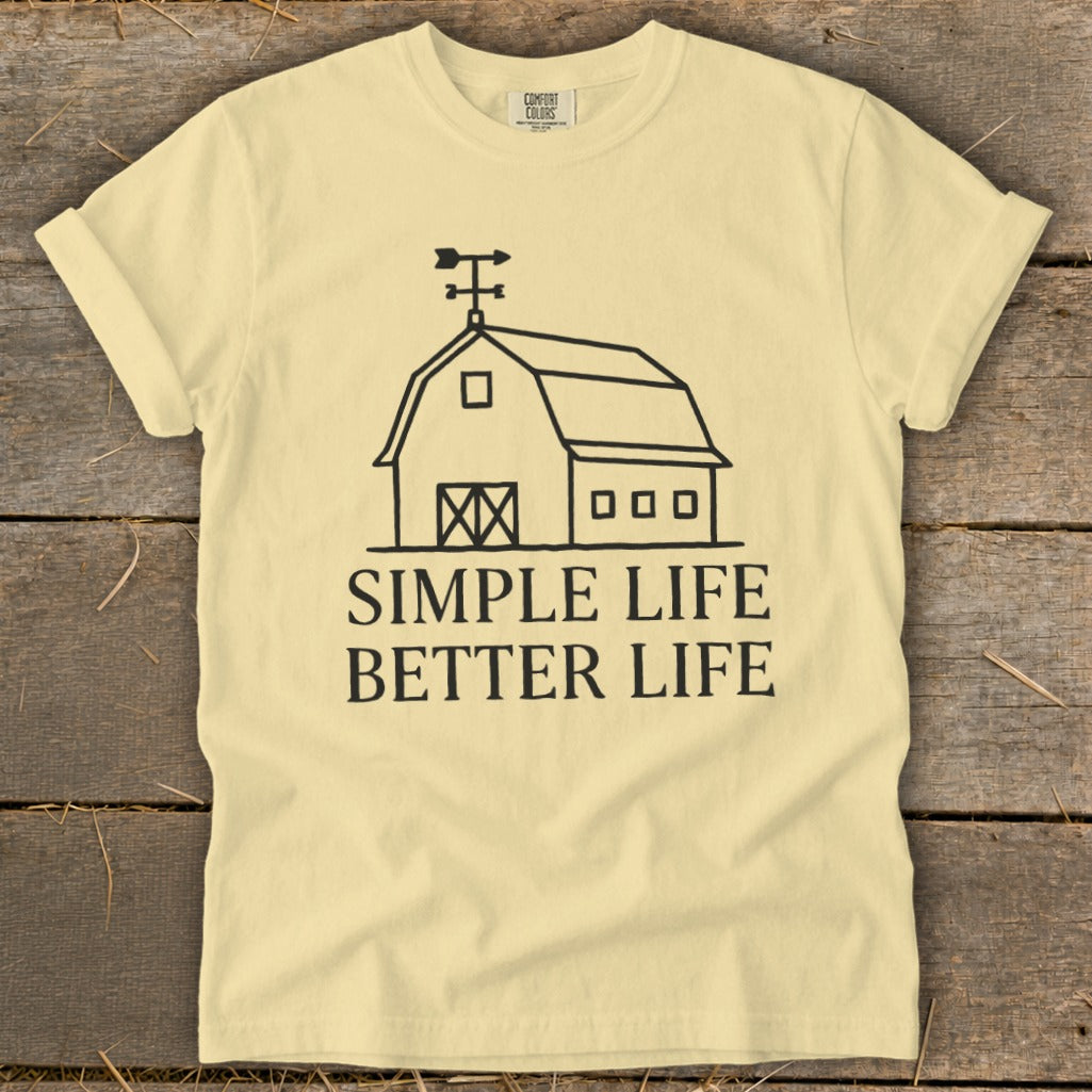 Yellow t-shirt with black line art of a barn and text: Simple Life Better Life.