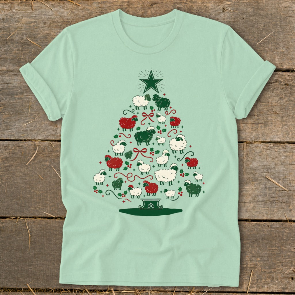Light green t-shirt with a Christmas tree made of white, black, and red sheep.