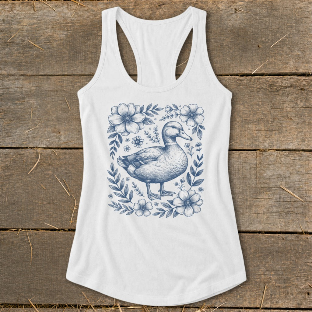 White tank top with a blue duck and floral sketch graphic.