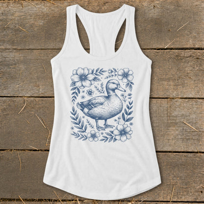 White tank top with a blue duck and floral sketch graphic.