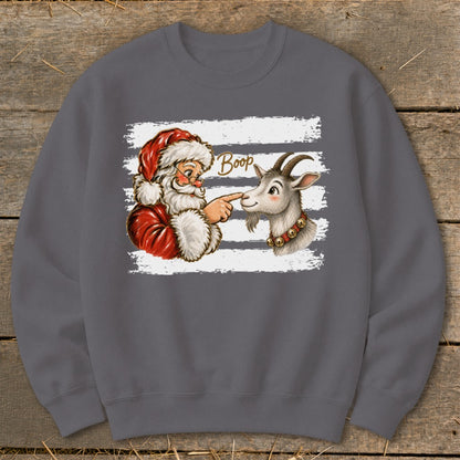 Santa booping a goat on the nose with the word "Boop" written above.
