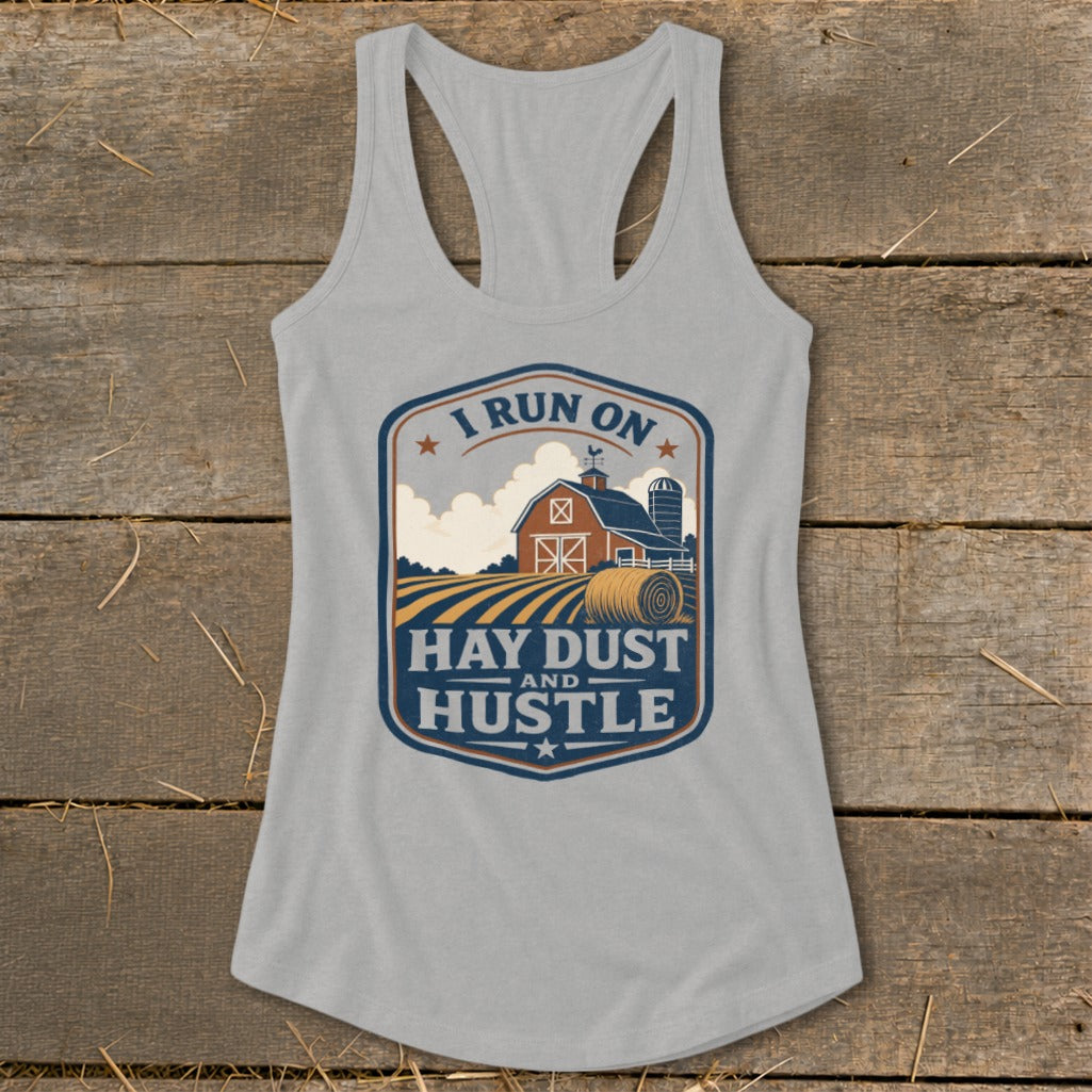 Grey tank top with a farm graphic that says "I Run On Hay Dust and Hustle."