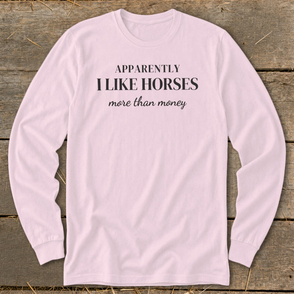 Pink long sleeve shirt with "Apparently I Like Horses More Than Money" text.