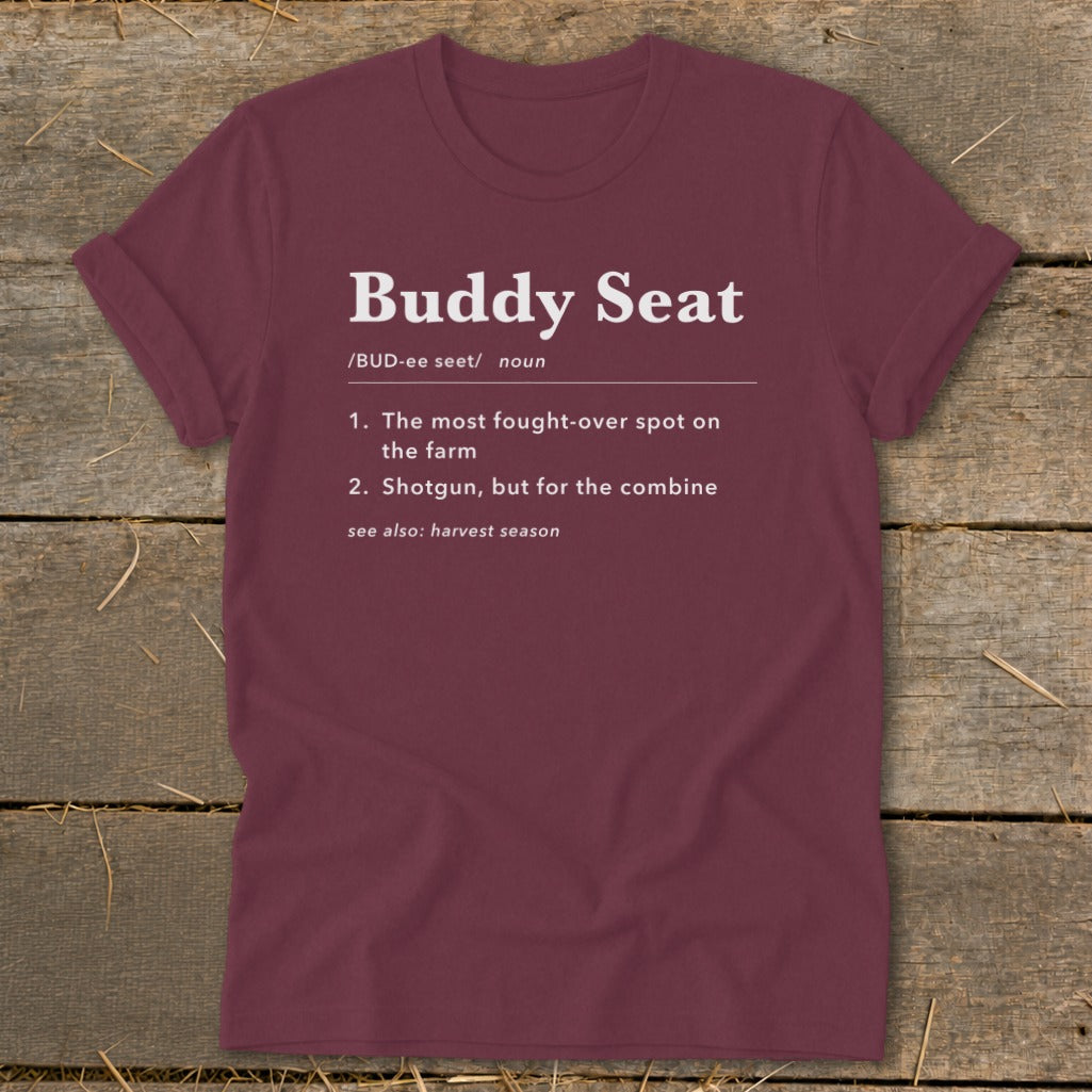 Maroon t-shirt with "Buddy Seat" definition text about farm spots.