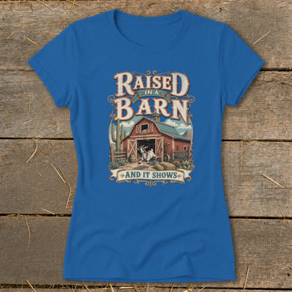 Blue t-shirt with "Raised in a Barn And It Shows" graphic featuring a goat and barn.