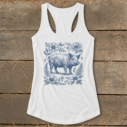 White tank top with blue pig and floral illustration on the front.