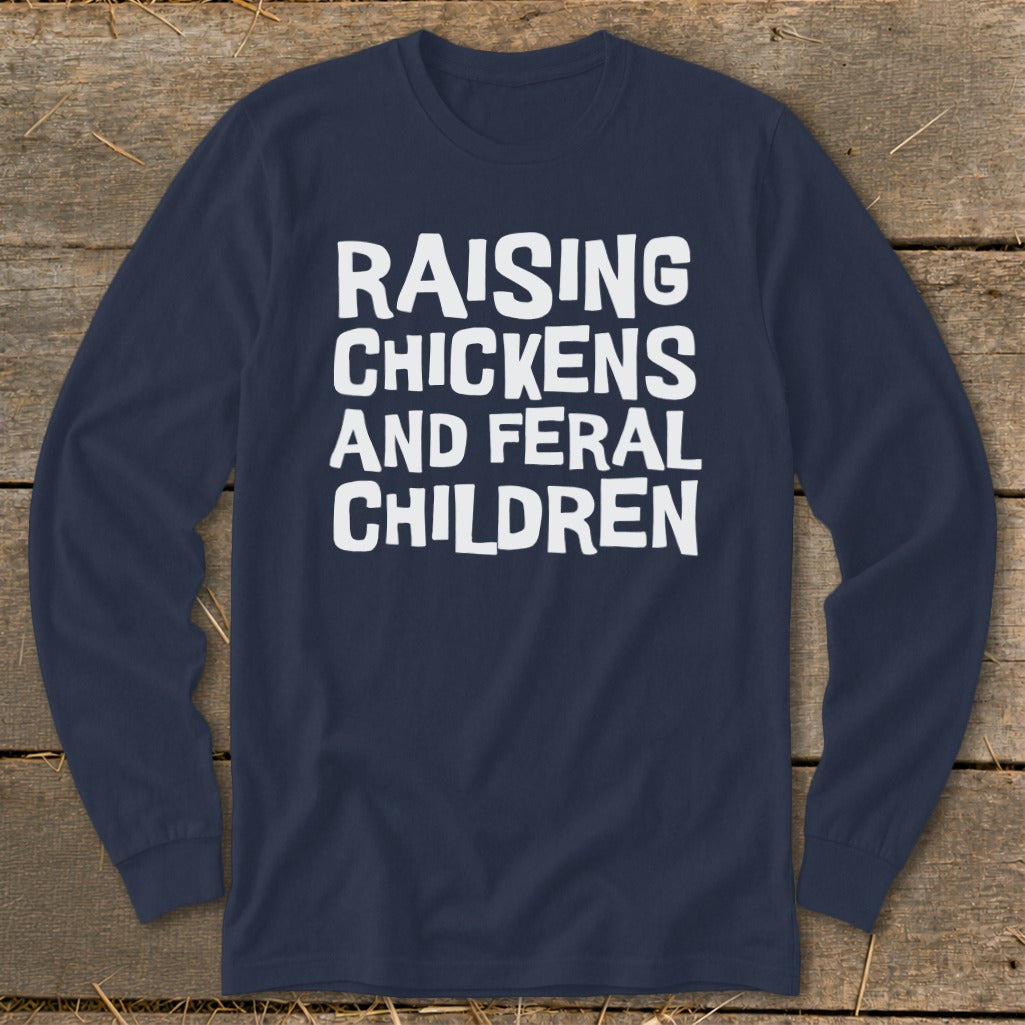 Navy long sleeve shirt with white text: "Raising Chickens and Feral Children".