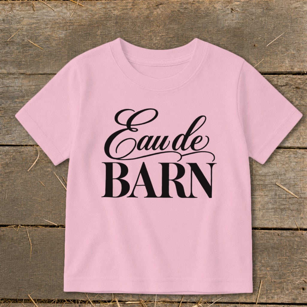 Pink t-shirt with "Eau de BARN" text in black script and block font.