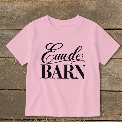 Pink t-shirt with "Eau de BARN" text in black script and block font.