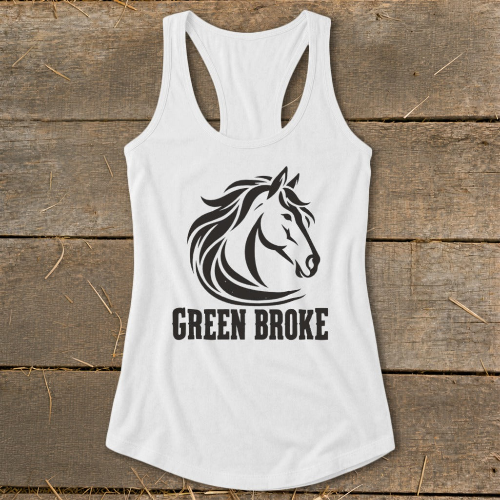A white racerback tank top featuring a black graphic of a horse head and the text GREEN BROKE on a rustic wooden background.