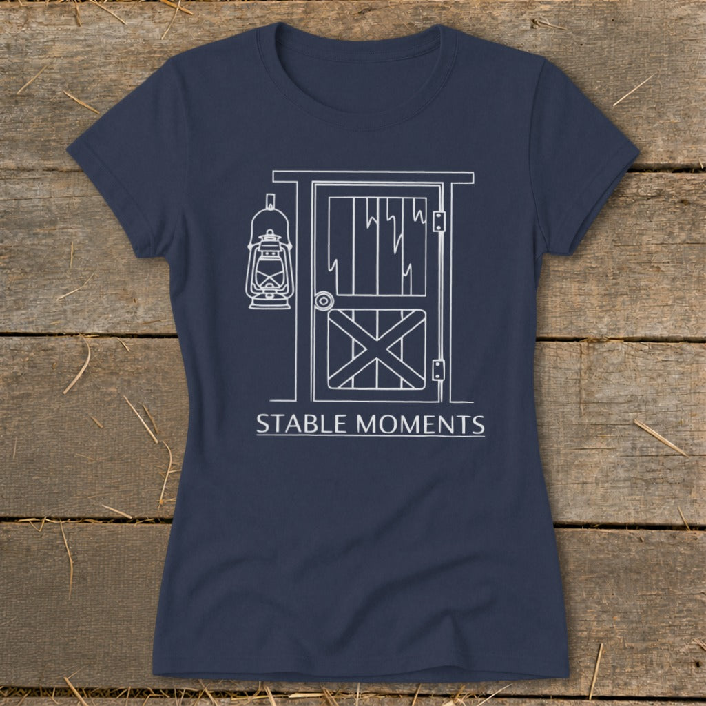 Navy t-shirt with white line art of a barn door and hanging lantern.