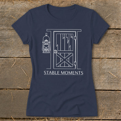 Navy t-shirt with white line art of a barn door and hanging lantern.