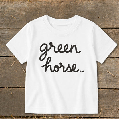 White t-shirt with "green horse.." text in black cursive script.