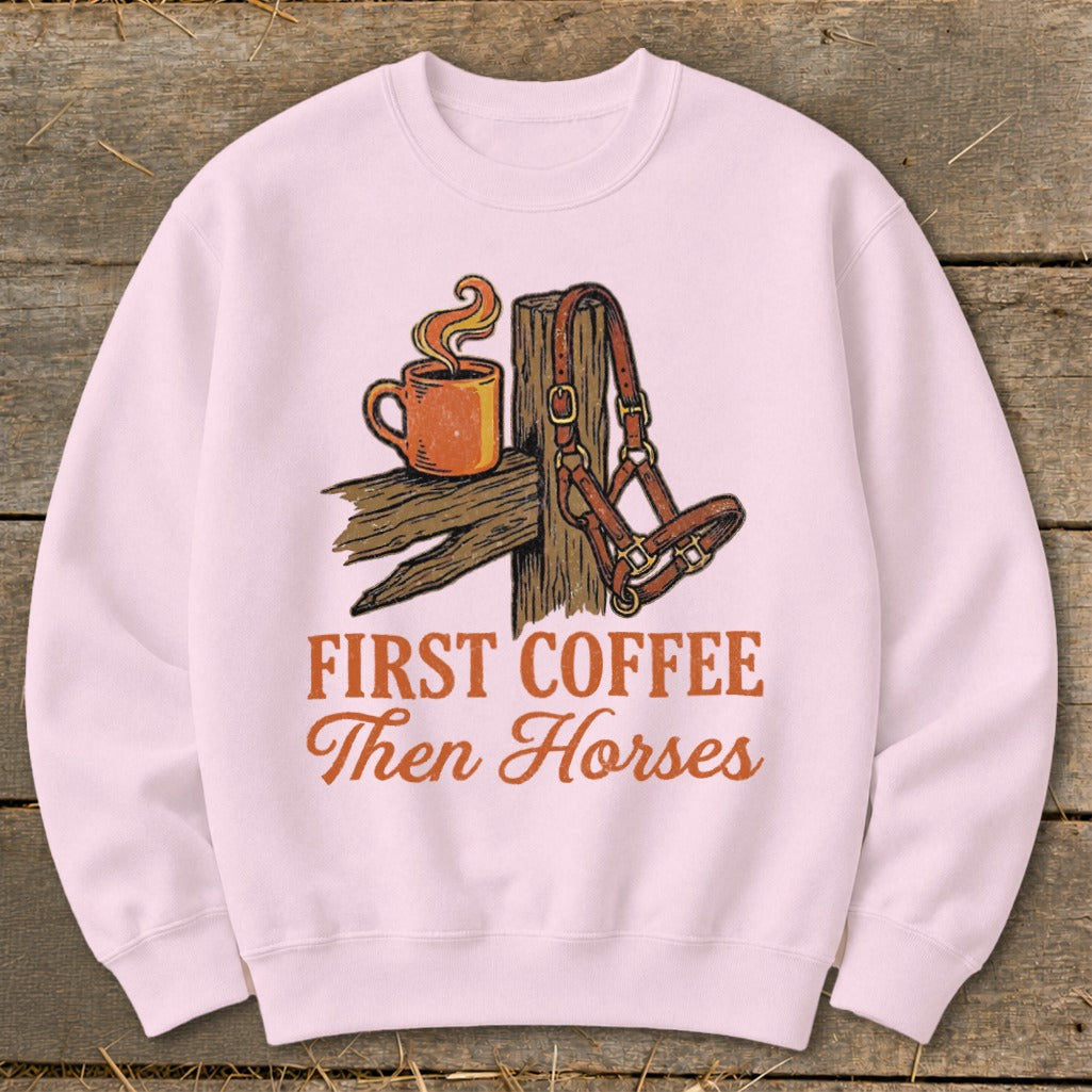 Pink sweatshirt with "First Coffee Then Horses" text and coffee mug and horse halter graphic.