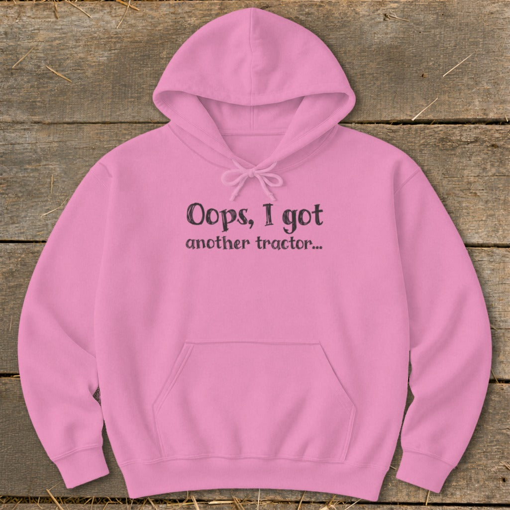 Pink hoodie with black text: "Oops, I got another tractor..."