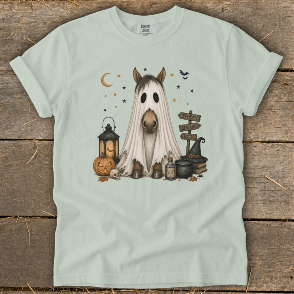 Horse wearing a ghost costume with Halloween decorations and signs.