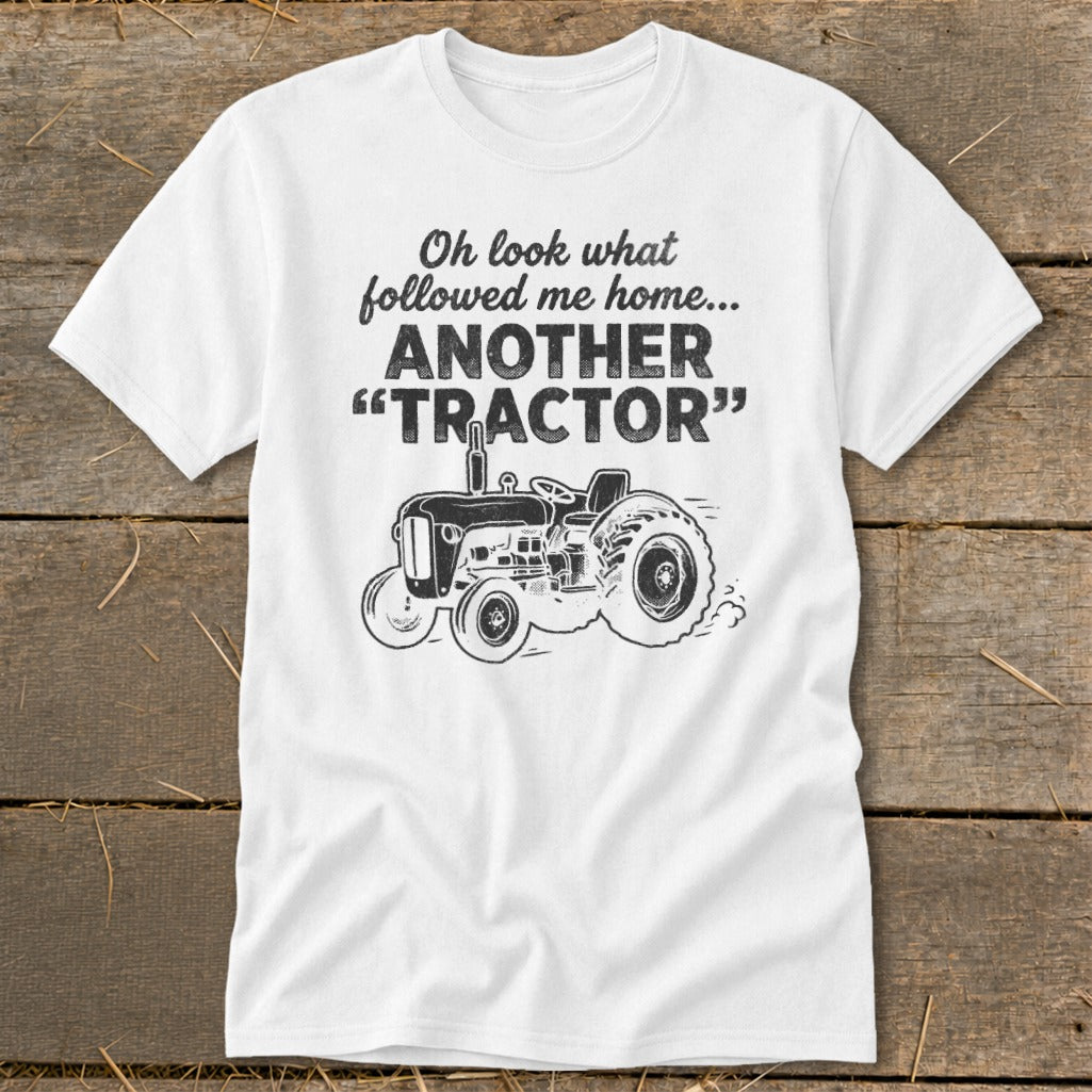 White t-shirt with black graphic: "Oh look what followed me home... ANOTHER 'TRACTOR'".