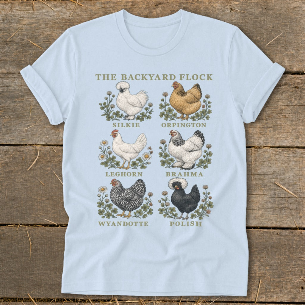 Light blue t-shirt with "The Backyard Flock" title and illustrations of six chicken breeds.