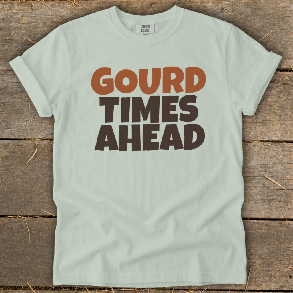 Light green t-shirt with "Gourd Times Ahead" text in brown and orange.