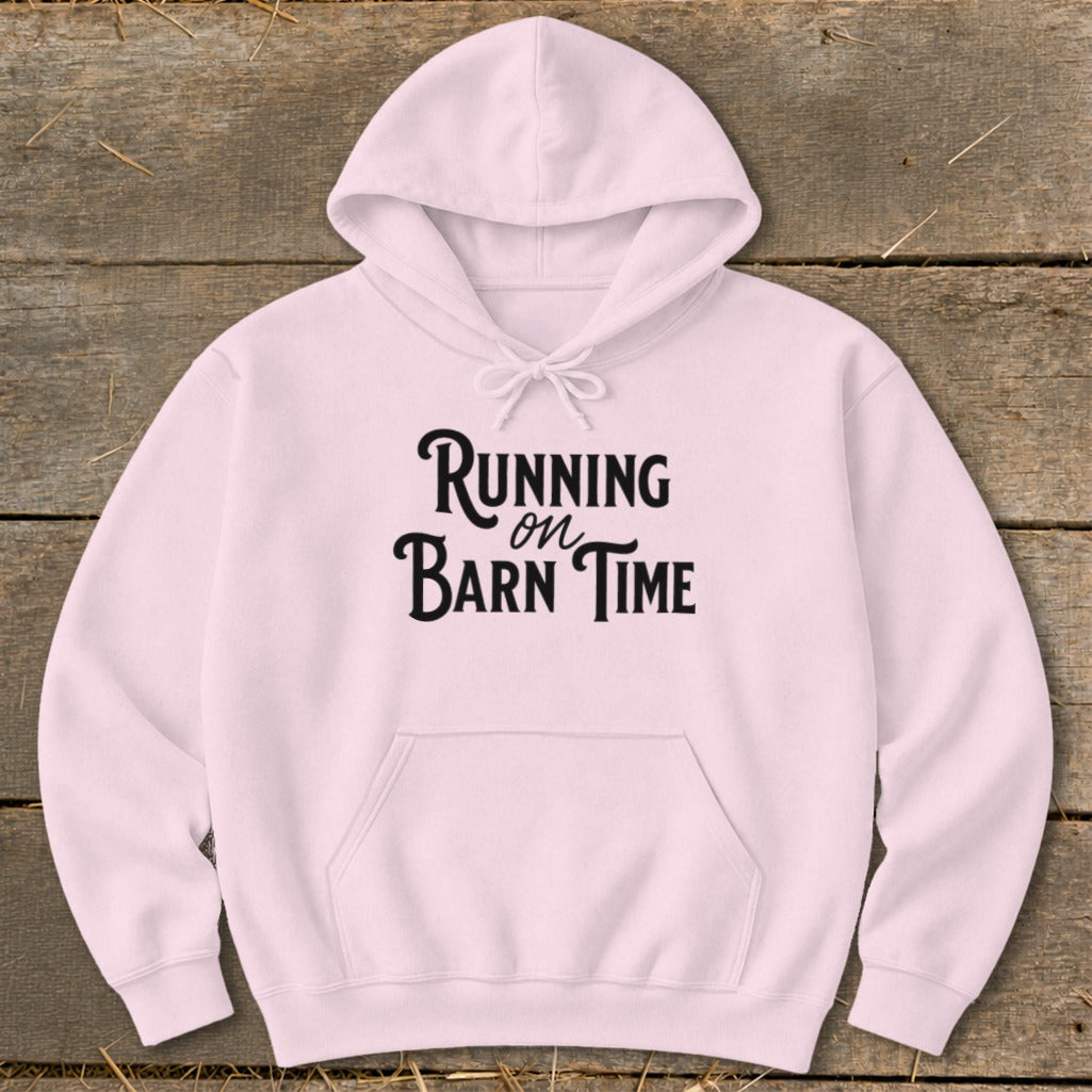 Pink hoodie with "Running on Barn Time" text in black cursive font.